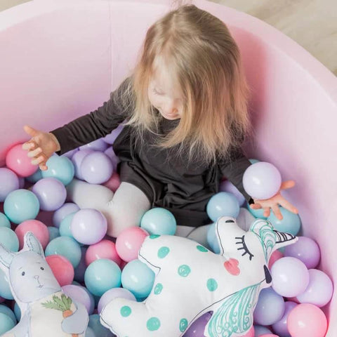 Toddler playing in a ball pit with pastel-colored balls, featuring 200 Count Plastic Soft Plastic Ball Pits Balls Colorful Play Pits Balls for Pet Dogs Ball Pits 2.2" Large Phthalate Free Bpa Free Balls for Toddlers 1-3 Baby Kids.