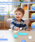Smiling toddler playing with non-toxic, BPA-free, phthalate-free toys for motor skill development, shape sorting, and eye-hand coordination.