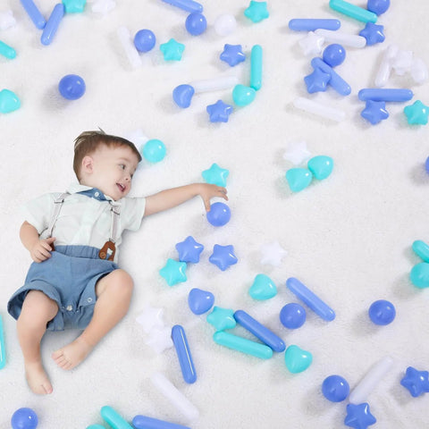 Toddler playing with Ball Pit Balls for Toddlers - Macaron Ball Pit Balls Crush Proof Plastic Toy Balls, 50pcs in blue, green, and white