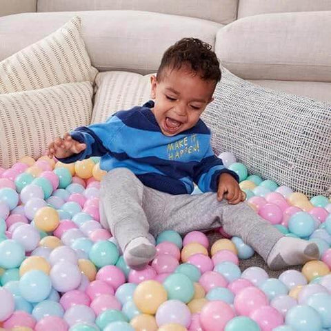 Toddler playing with BPA Free Crush-Proof Plastic Ball Pit Balls, Pack of 400 Balls, 6 Pastel Colors, for Kids 12+ Months, with Storage Bag