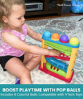 Child playing with a toy set featuring Set of 6 Replacement Balls Compatible with VTech Pop-a-Balls Push and Pop Bulldozer Toys