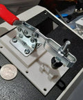 16 Pack Toggle Clamps Set For Woodworking And DIY Projects, 60 Lb Holding Capacity, installed, close-up view with coin for scale