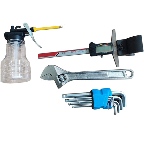 Assorted line boring and welding tools including digital caliper, wrench, and hex keys for Workhorse Portable Line Boring Welder Kit.