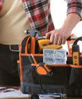 Person reaching for tools in bag with Wood Screws Assortment Kit 152 Pcs Silver Phillips Screws visible on table