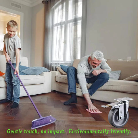 Man and child tidying living room with 5 Inch Heavy Duty Caster Wheels Set Of 4 With Brakes Up To 3000 Lbs shown in corner.