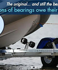 Boat trailer showing USA Made Chrome Plated Bearing Protector With 19B Bra And Blue Grease Indicator Bearing Buddy For Boats RVs And More.