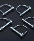 Set of five silver trailer coupler pins on black background, from Ten Pack One Quarter By Four Inch Trailer Coupler Pin Set Heavy Duty Locking Towing Pin Safety Pin For Trailers Lawn And Garden Equipment Farm Wagons Silver.