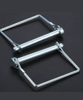 Alt Tag: Two carbon steel wire lock pins on black background, part of 8 Pack Trailer Coupler Pins Three Eighths By Two And Three Quarters Inch Heavy Duty Wire Lock Pins For Trailers, RVs, Boats, Farm Equipment Built Tough For Towing With Hitch Pin And PTO Shaft Locking Pin.