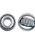 Close-up of LM11949 and LM67010 bearings from Trailer Hub And Wheel Bearing Kit For 1-1/4 Inch Axle With LM11949/10 And LM67048/10 Bearings Includes 03813TC Seals Dust Covers And Cotter Pins Two Sets For On The Road Trailer Repairs.