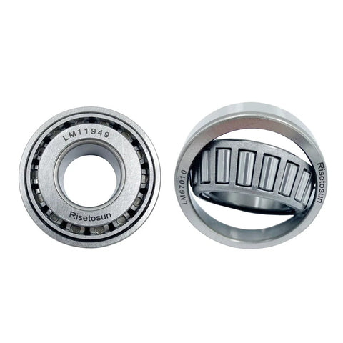 Close-up of LM11949 and LM67010 bearings from Trailer Hub And Wheel Bearing Kit For 1-1/4 Inch Axle With LM11949/10 And LM67048/10 Bearings Includes 03813TC Seals Dust Covers And Cotter Pins Two Sets For On The Road Trailer Repairs.