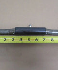 Single weld-on trailer ramp door hinge with integrated grease fitting next to measuring tape, 1x10 inch size, raw 9-gauge steel construction.