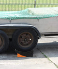 Raised Tire Change Ramp And Curved Leveling Blocks For RV And Trailer With Wheel Chock And Rubber Pad, 6 Inch Lift in use