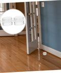 Six Piece Door Silencer And Stopper Sliding Buffer Set installed, transparent silicone wedge on hardwood floor near open door