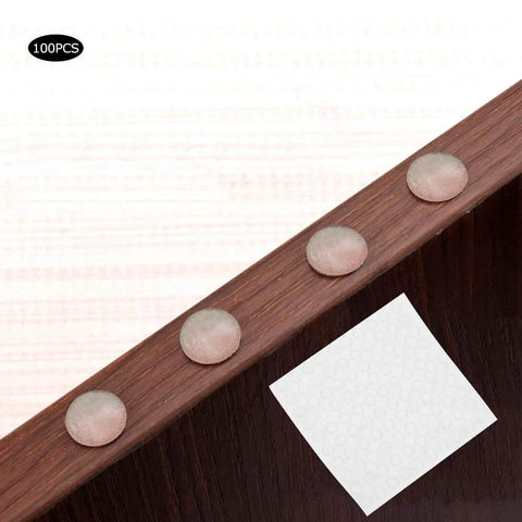 Self Adhesive Anti Slip Silicone Bumpers 200 Pcs Transparent Foot Pads for Furniture displayed on wooden surface