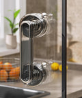 Adhesive Suction Cup Door Handle For Cabinets Windows Glass Doors And Refrigerators installed on a glass surface in kitchen