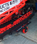 Trax Wheels 2.0 Rear Wheel Casters for snowmobiles and snow bikes installed beneath a snowmobile track, 29x16 inch castor