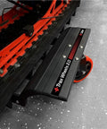 Trax Wheels 2.0 Rear Wheel Casters for Snowmobiles and Snow Bikes, installed under a vehicle, showcasing heavy-duty design.