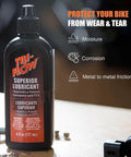 Tri-Flow Superior Lubricant bottle on workbench with moisture, corrosion, and metal to metal friction benefits listed