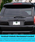 Rear view of a truck with dual locking T-handle kit for truck caps, left and right, in black installed on the camper shell.