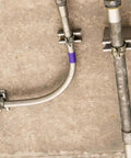 Installed ten-piece universal tube clamps deliver secure, corrosion-resistant support for Unistrut channels; 2 inch wall mount conduits