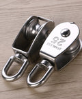 Two Pack 25mm 304 stainless steel pulley blocks with a 400 kg rating deliver reliable lifting, shown on a wooden surface