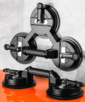 Two Cup Pro Grade Aluminum Suction Cup Glass Lifter With High Vacuum Grip for lifting glass panels on orange surface, black.