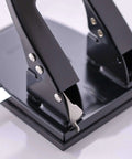 Close-up of Two Hole Paper Punch 30 Sheet Capacity Black with adjustable guide and easy chip tray, ideal for office and school use.