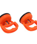 Two Pack Glass Sucker Vacuum Lifters For Home Use in orange, lightweight handheld suction cups for lifting glass and tiles.