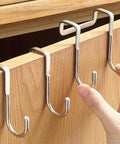 Two Pack Stainless Steel S Hooks No Drill Multipurpose Hanging Hooks For Kitchen Bedroom And Bathroom on a wooden cabinet