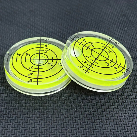 Two acrylic circular bubble levels from Three Pack Small Circular Bubble Levels 32x7mm Acrylic Round Spirit Level For Layout Tools.