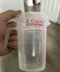 Two Stroke Oil Measuring Cup 16 Oz Mixing Pitcher With 15 In 1 Ratio Conversion Chart shown with handle and measurement markings