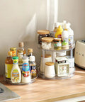Two Tier Clear Lazy Susan Turntable Organizer With 360 Degree Rotation on kitchen counter, holding spices and condiments