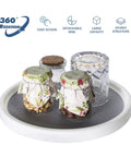 Two Tier Rotating Lazy Susan Organizer With Non Skid Base For Pantry Cabinets And Kitchen Countertops holding jars.