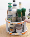 Two Tier Non Skid Spinning Spice Rack Turntable With 360 Degree Rotation, 10 Inch Lazy Susan Organizer filled with bottles and jars