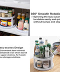 Two Tier Non Skid Spinning Spice Rack Turntable With 360 Degree Rotation in white and gray inside kitchen cabinet.