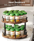 Two Tier Wood Lazy Susan Spice Rack Organizer With 360 Degree Rotating Turntable full of spice jars on kitchen counter