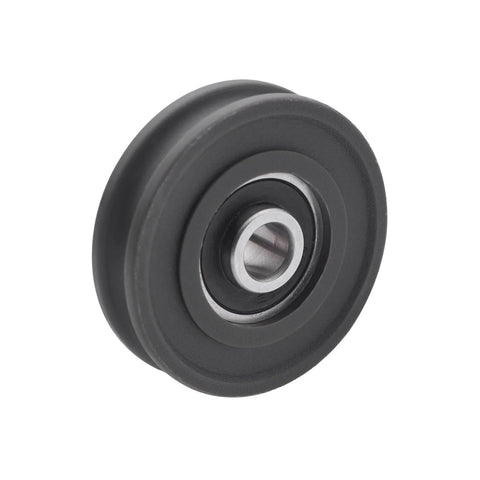 Close-up of a black nylon 4Pcs U Groove Pulley Wheel U-Groove Roller Guide Pulley Rolling Bearing Roller Wheel 8x45x11.5mm.