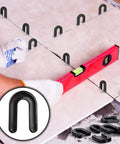 800 Pack U Shaped Tile Spacers For Leveling And Tile Alignment Plastic Structural Shims Set In Four Sizes And Color Codes Black Yellow Red Blue 200 Pieces Per Size For Easy DIY Home Renovation And Quick Precise Tile Spacing used in tiling project with a level.