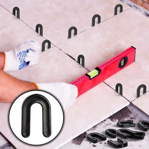 800 Pack U Shaped Tile Spacers For Leveling And Tile Alignment Plastic Structural Shims Set In Four Sizes And Color Codes Black Yellow Red Blue 200 Pieces Per Size For Easy DIY Home Renovation And Quick Precise Tile Spacing used in tiling project with a level.