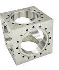 Six Channel UHV Cube Flange in 304 stainless steel with 101.6mm bore and sixteen M8 bolt holes for complex vacuum chamber layouts.