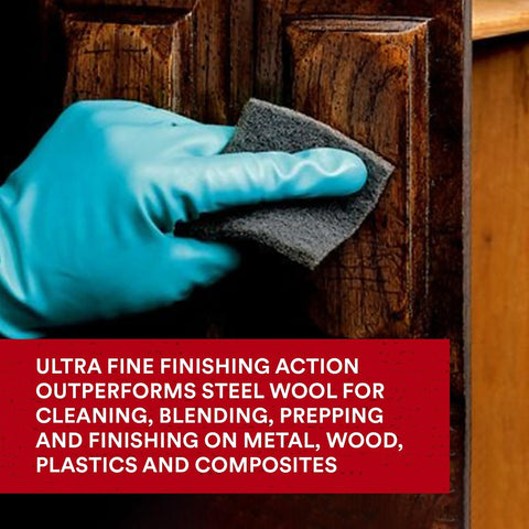 Person using Ultra Fine Hand Pad 6 X 9 Inch Nonwoven Silicon Carbide For Surface Prep on wooden surface
