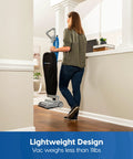Person using Ultra Lightweight 14L Bagged Upright Vacuum Cleaner With LED Headlight And 2 Speed Settings For Pets, Carpets, Hard Floors.