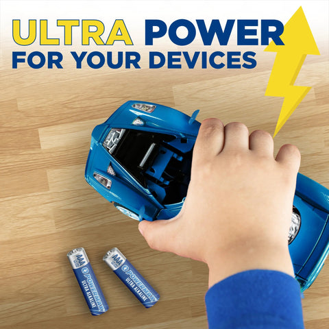Child's hand placing 24 Pack AAA Alkaline Batteries Ultra Long Lasting For Home And Office Use into toy car on wooden surface