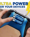 Person installing AA batteries from the Alkaline Battery 24 Count Pack 12 AA And 12 AAA Reclosable Packaging into a game controller