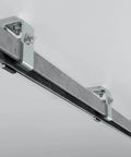 View of Unistrut Channel Trolley Track, 57 in, 12 Gauge Steel U-Channel, Galvanized Finish installed on ceiling for automation systems.