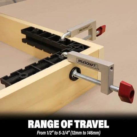 Universal Fence Clamps For Table Saws And Router Tables 2 Pack With Three Eighths Inch Rod installed on a wooden fence