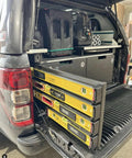 Universal level holder 2 pack with yellow levels stored securely in vehicle trunk, ideal for organized tool storage and easy transport.