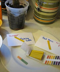 2 Pack pH Test Strips, 160 Strips pH.1-14 Universal pH Test Paper shown with test samples and color chart on a table