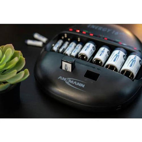 Universal Smart Battery Charger And Maintenance Station For AA AAA C D 9V USB charging C batteries on black table