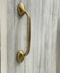 Richmond Unlacquered Brass Cabinet Pulls And Solid Brass Drawer Handles For Kitchen Cabinets And Furniture, installed on wood surface